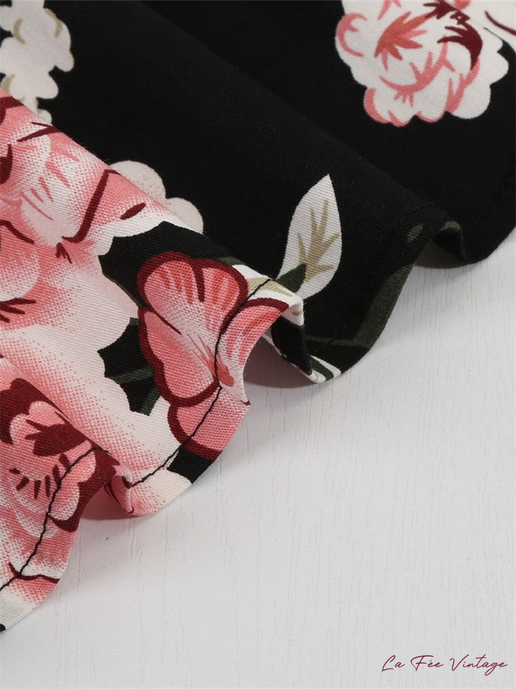 Robe d'été noire à fleurs pin-up vintage années 50